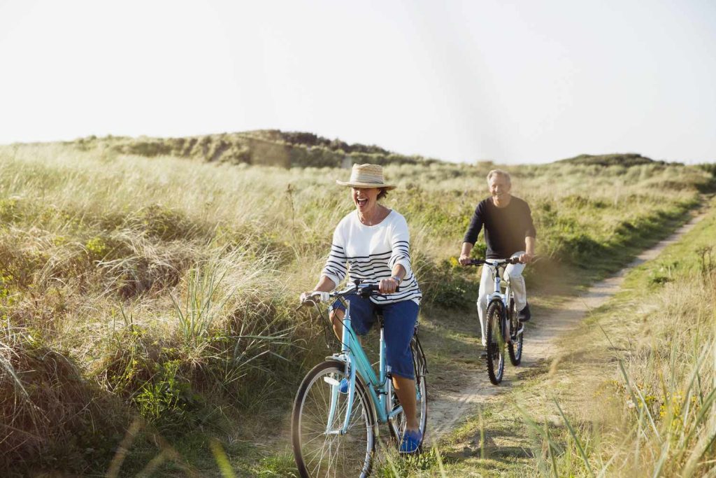 Retired couple riding bicycle