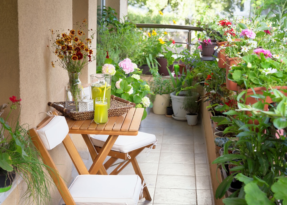 Beautiful,Terrace,Or,Balcony,With,Small,Table,,Chair,And,Flowers.